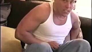 Straight muscular hunk wanking on couch