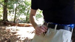 I'm beating off in the woods in my blue boxers by a tree.