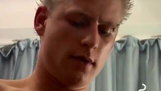 Buffed Keith displays body and uncut penis while sitting