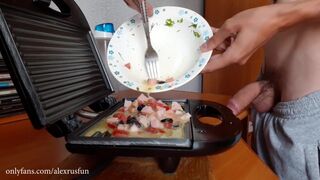 Horny Russian guy with a big dick cooks breakfast naked