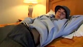 Tattooed young guy Kelly Cooper jacks off his long hard dick