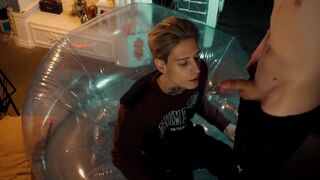 Two sweet guys share an inflatable chair