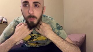 Bald blue-eyed white guy with uncut dick strips down on the bed to reveal very hairy skinny body