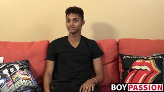 Black young man gives an interview and stimulates himself