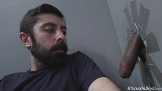 White man sucking and fucking a black cock at a gloryhole